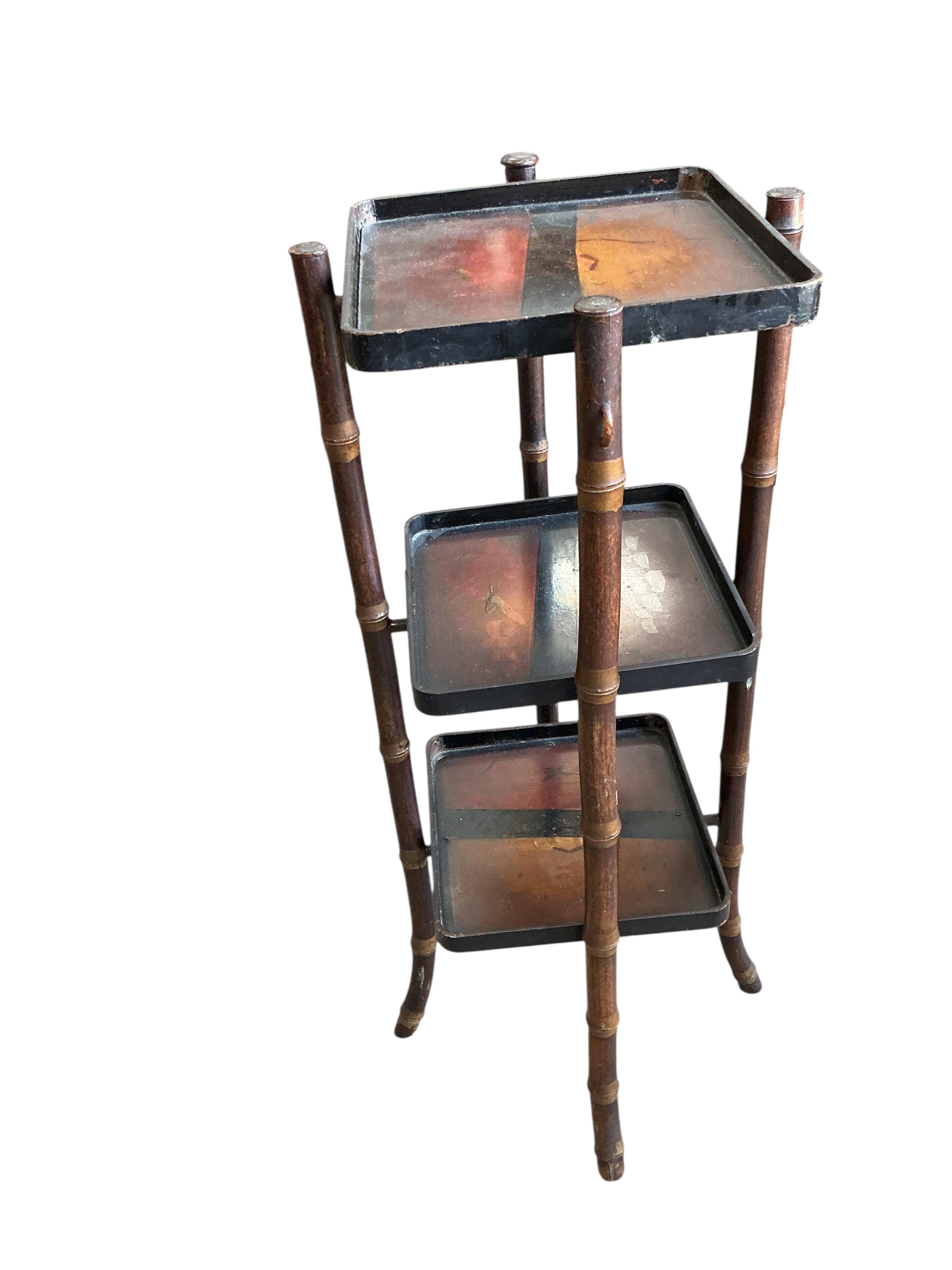 An early 20th century French rectangular bamboo occasional table, width 50cm, depth 36cm, height 71cm together with a lacquered bamboo three tier cake stand